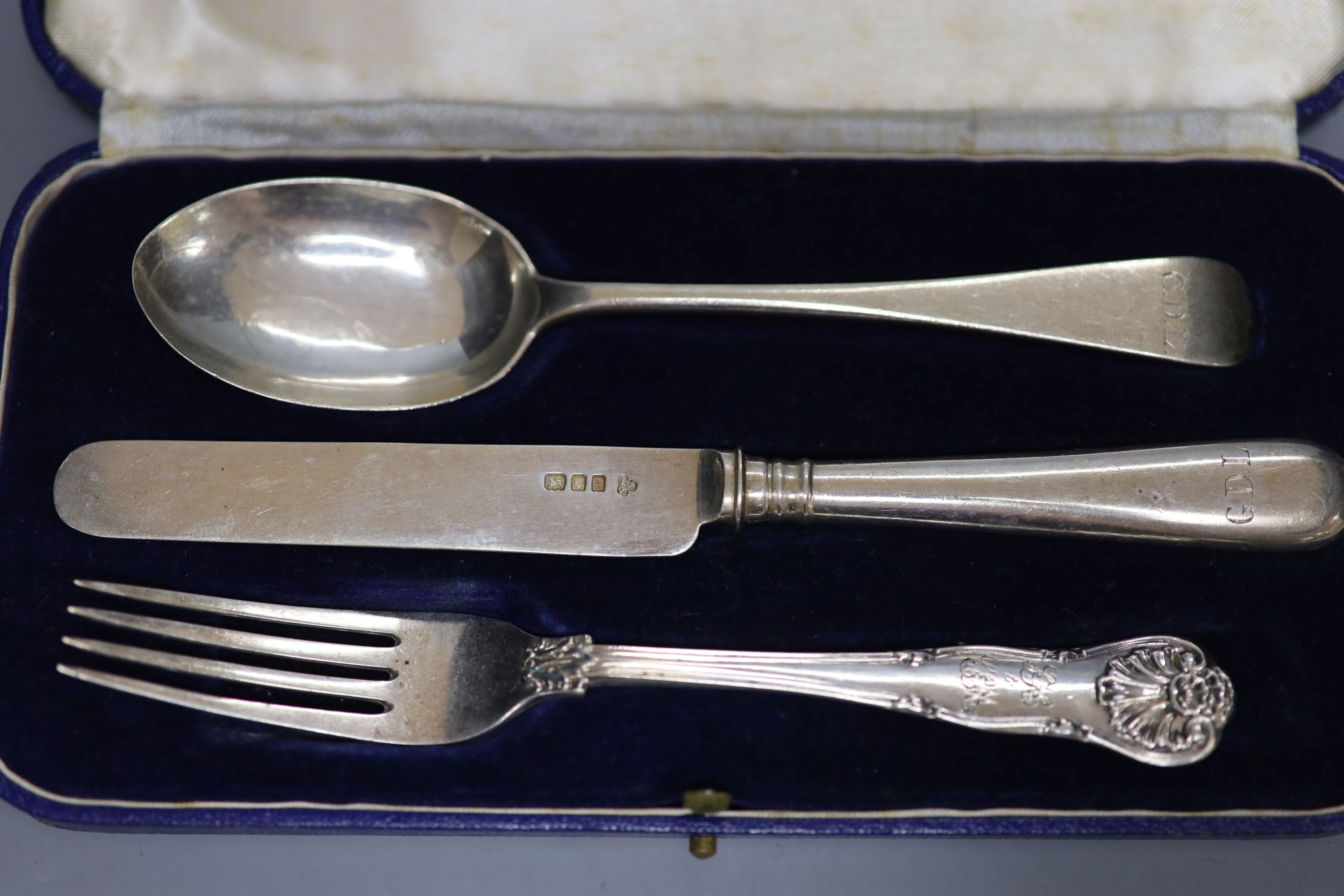 A cased set of six Art Deco silver cake forks, Sheffield, 1936 and two cased silver christening trios.